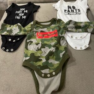 Three baby newborn onesies
